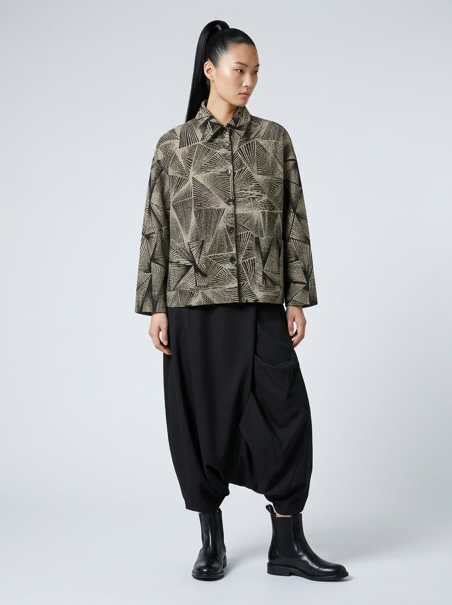 Model wearing Shirley fan print jacket in black with relaxed trousers