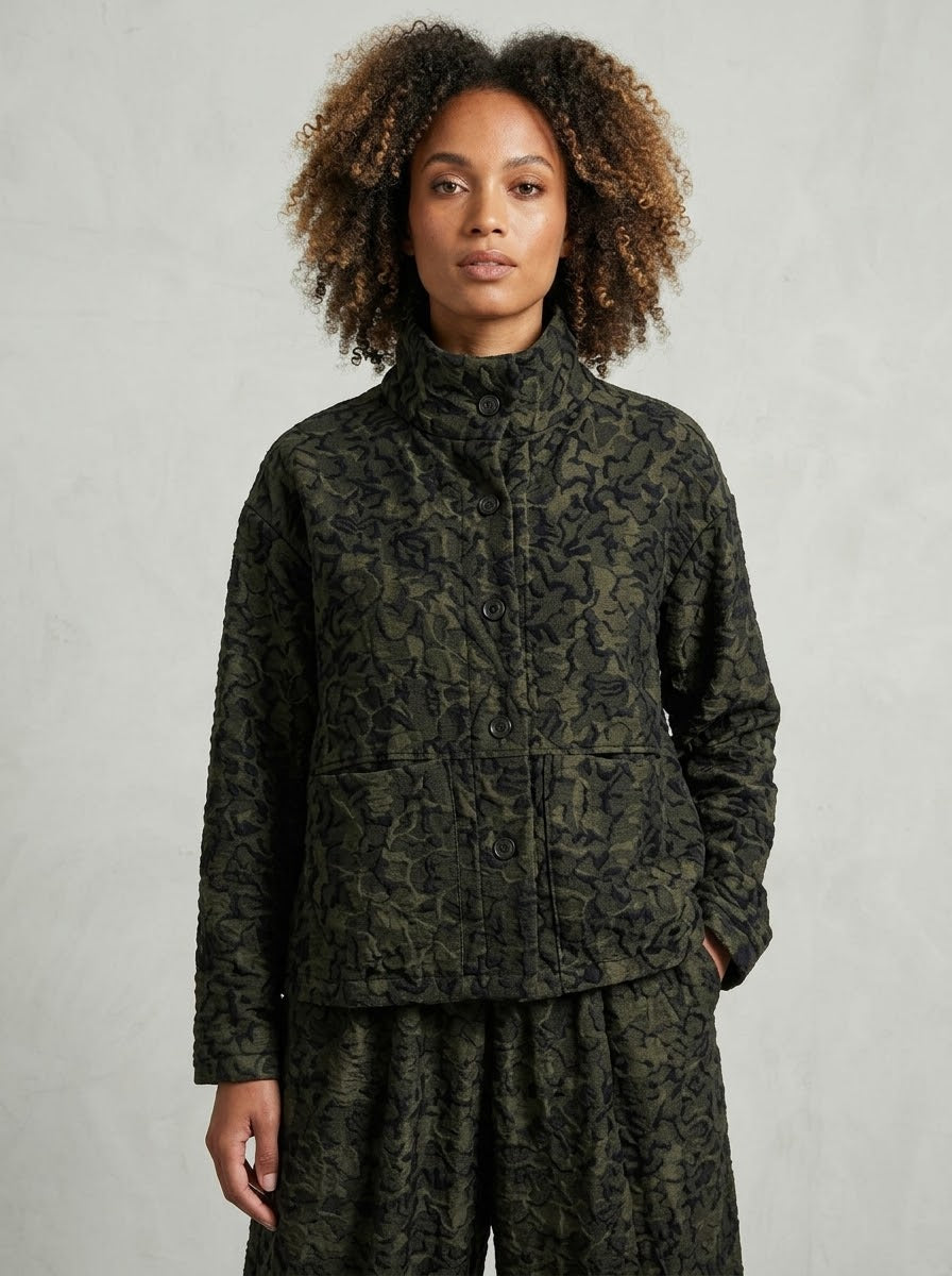 Model wearing Pebbles printed jacket in bronze, front view