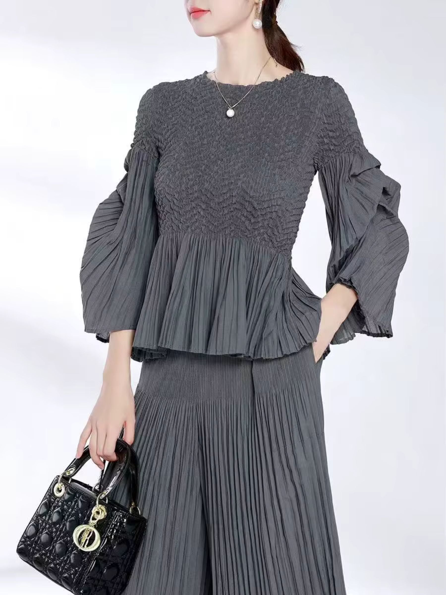 Miranda - Peplum hem part pleated top