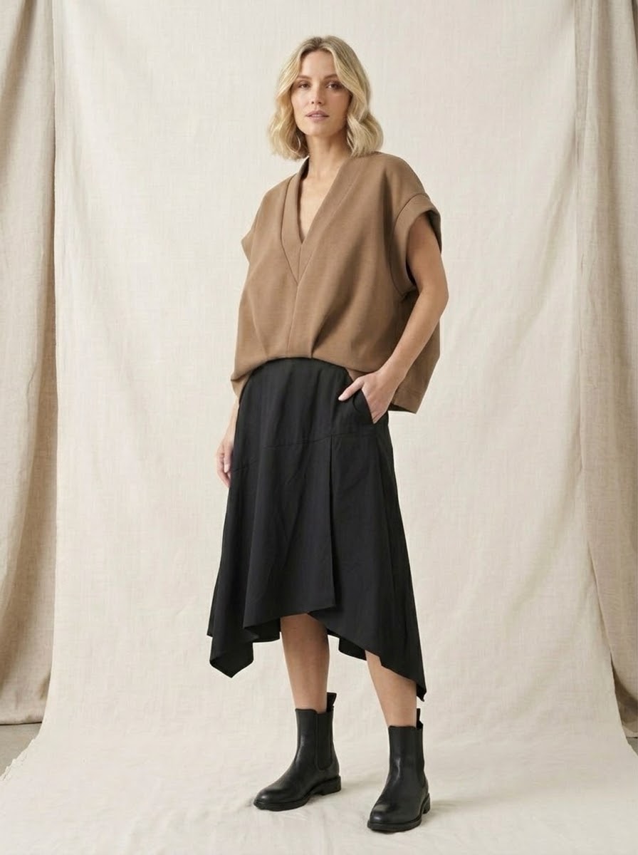 Model wearing camel Bronte curved-hem top, full front view