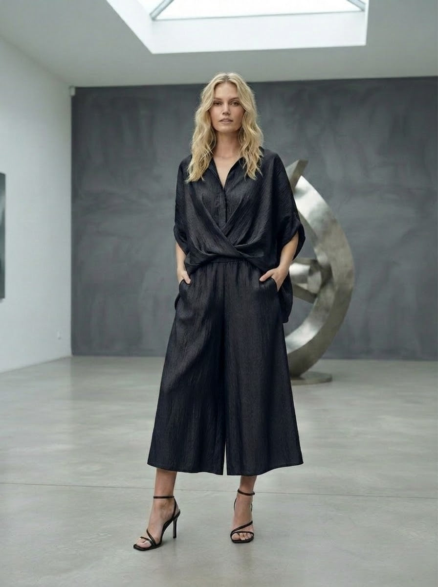 Model wearing black Lavender shimmer trousers with matching shirt, full-length view