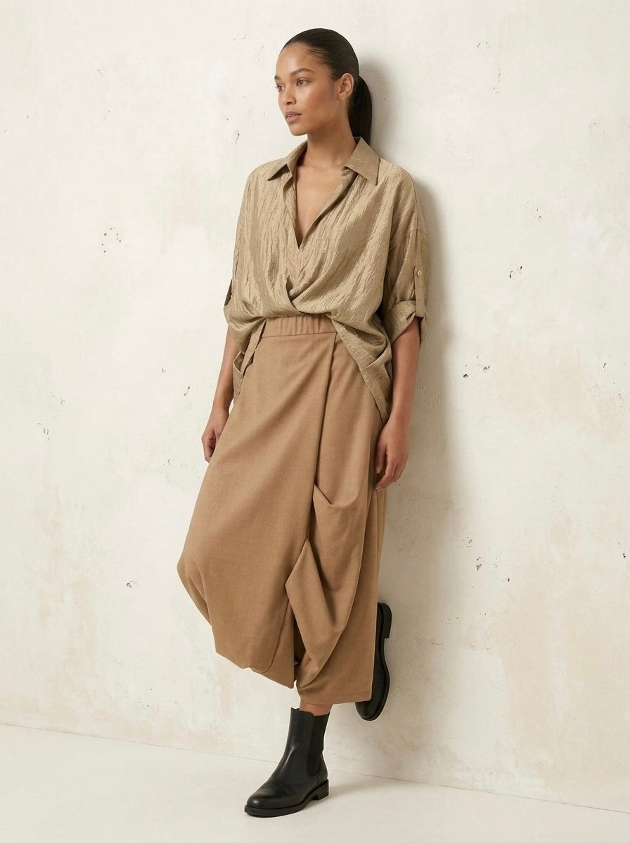 Model wearing the Roberta camel harem trousers, side view