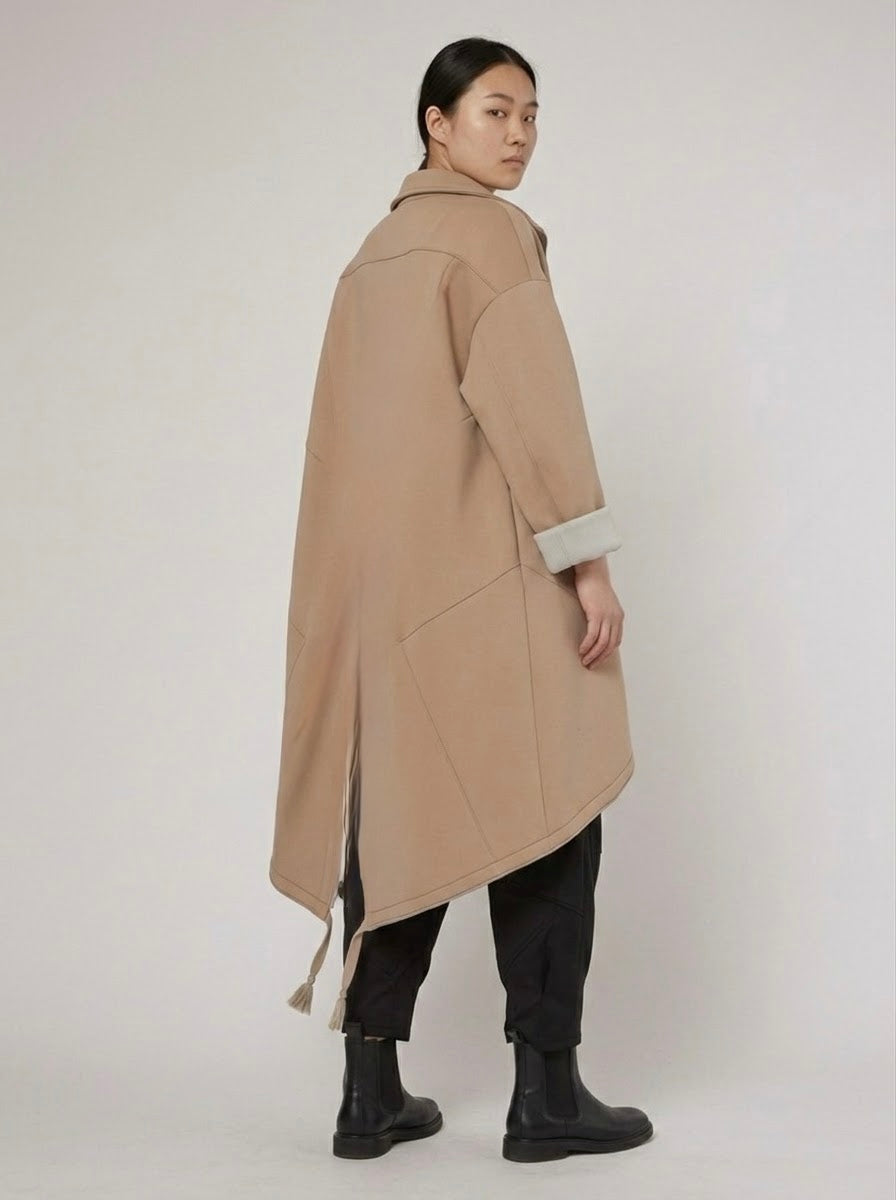 Back view of the Bronte camel midi coat showing its drawstring hem
