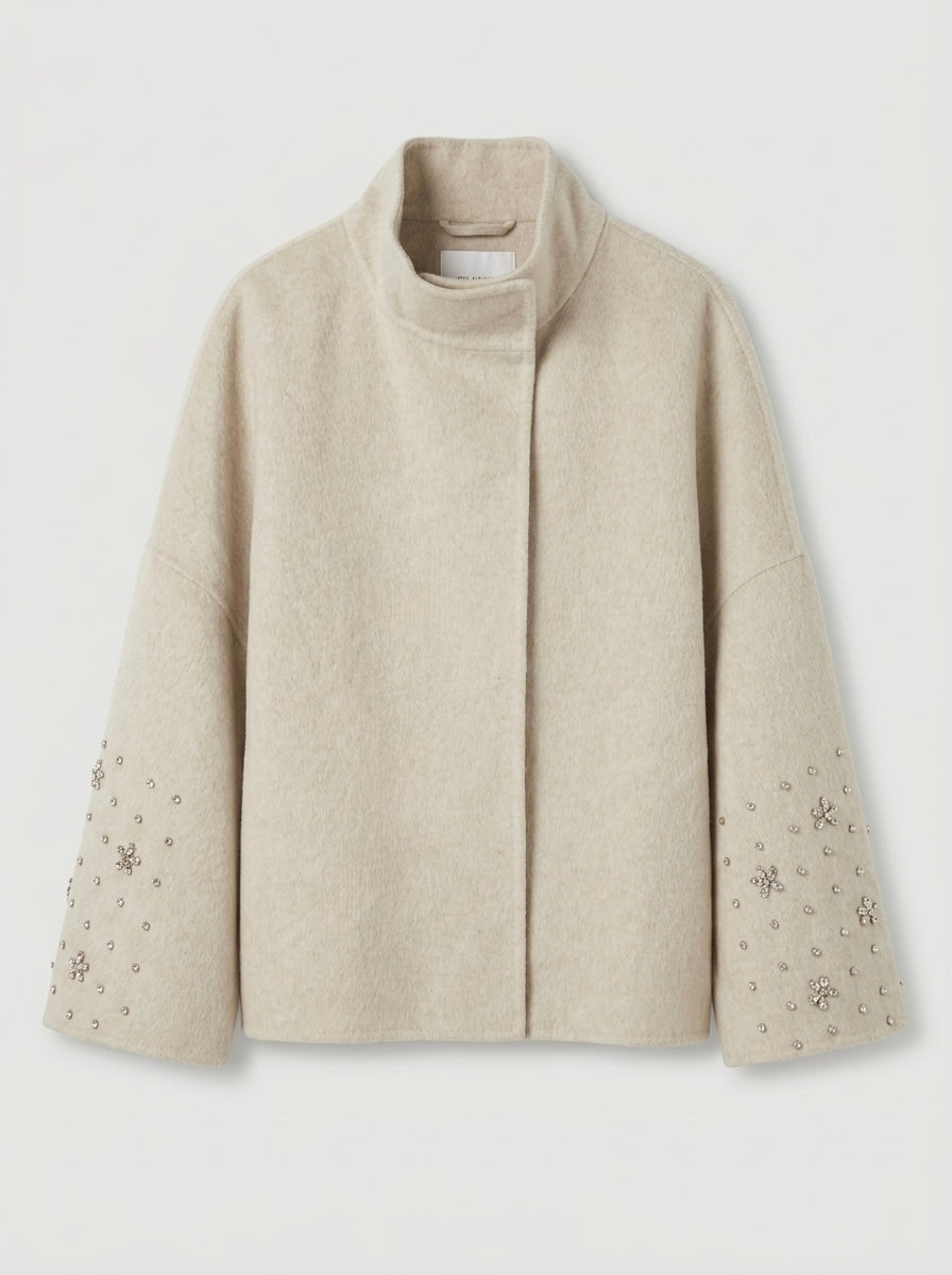 Soraya cream cape jacket showing diamante sleeve detailing