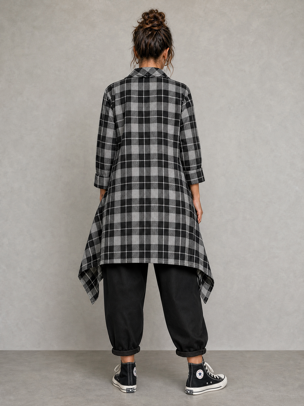 Model wearing Blanche grey check asymmetric shirt with tailcoat hem, back view