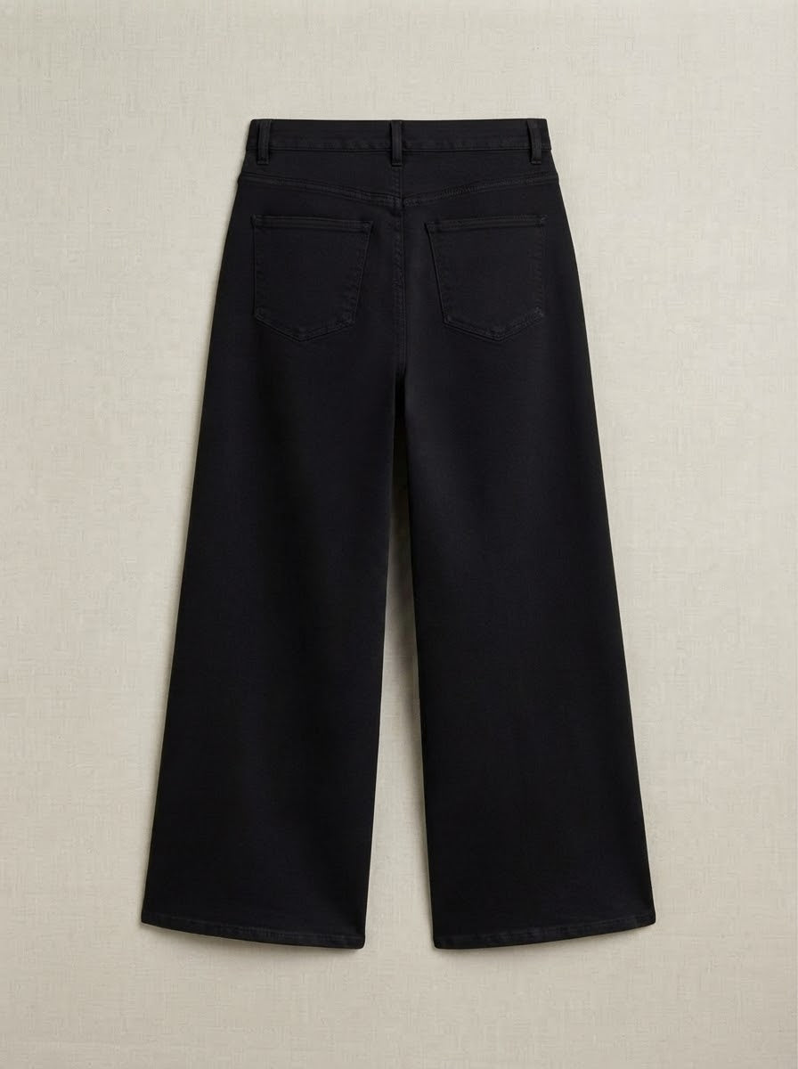 Black Delilah wide leg jeans, back product view showing patch pockets and relaxed wide legs