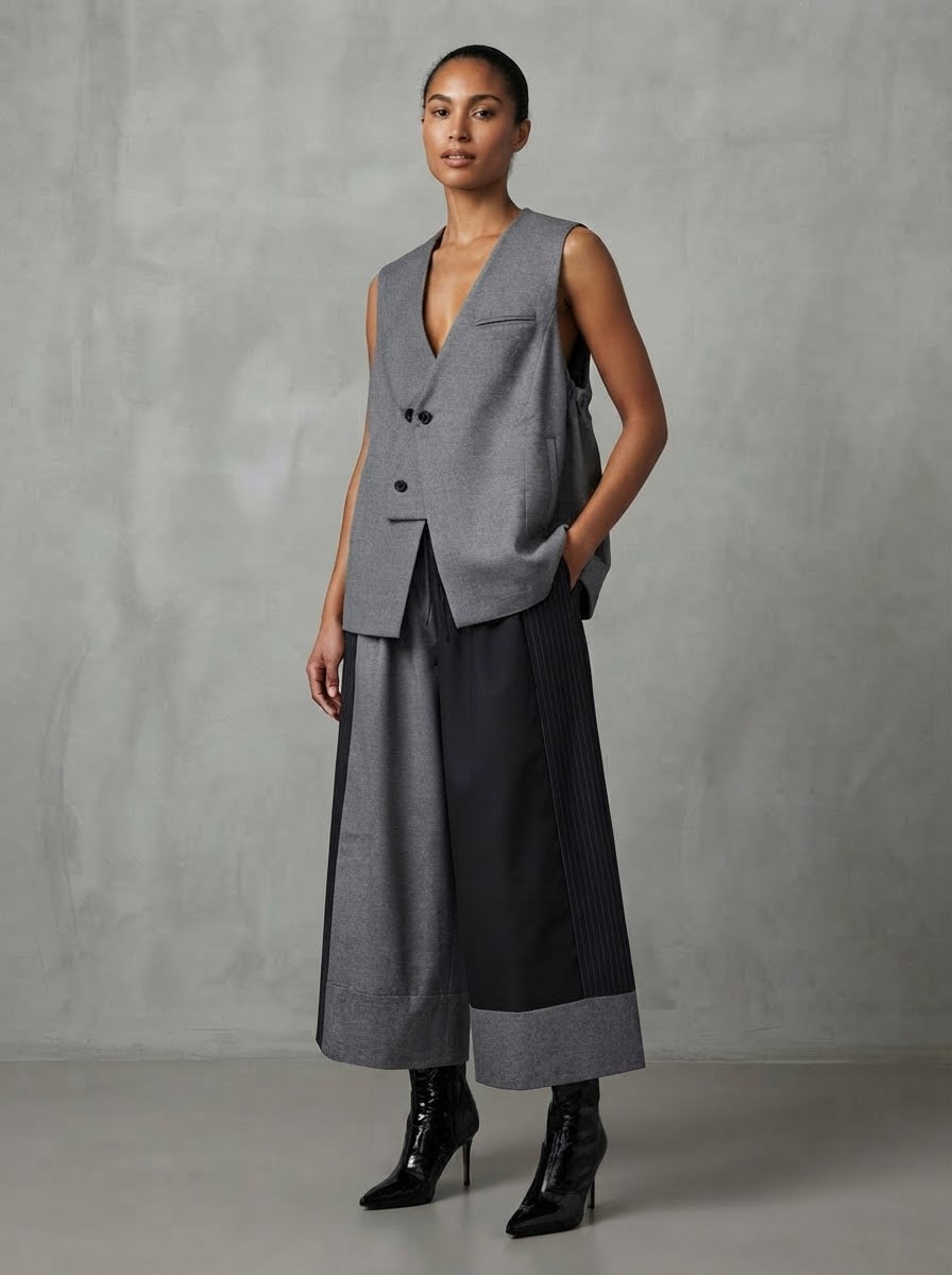 Model wearing grey Valaria A-line gilet, three-quarter view