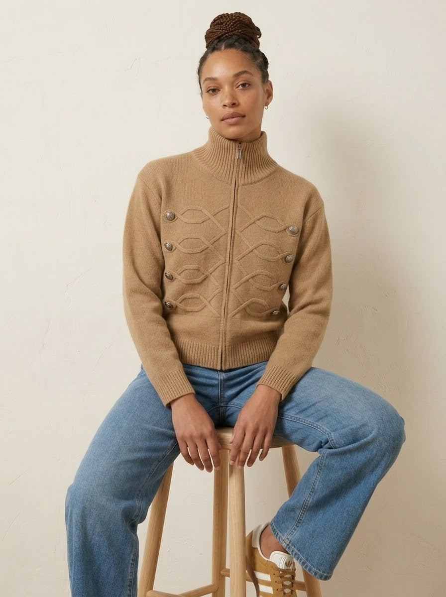 Model wearing Simone regiment knitted jacket in camel, seated front view