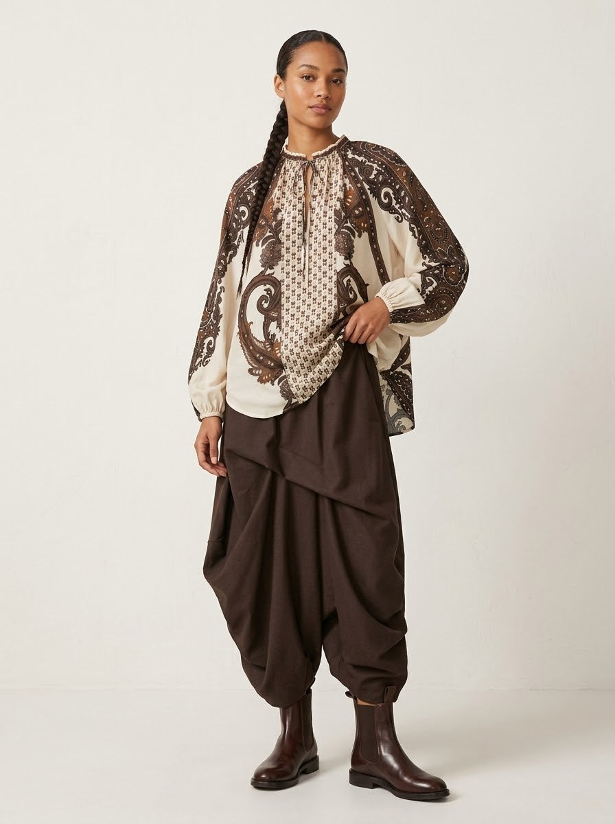 Model wearing Jessica leaf printed blouse in cream, front view
