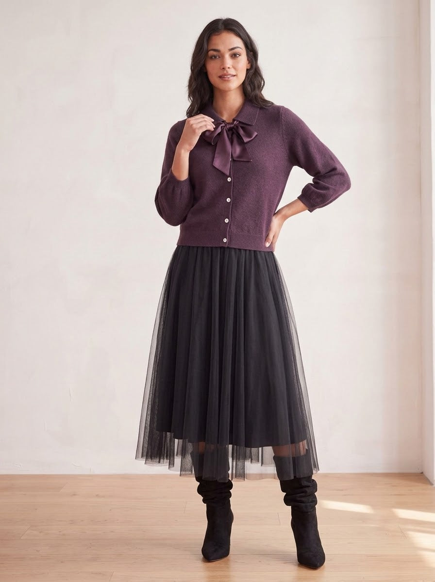 Model wearing the Antoinette plum bow-tie cardigan with a black tulle skirt