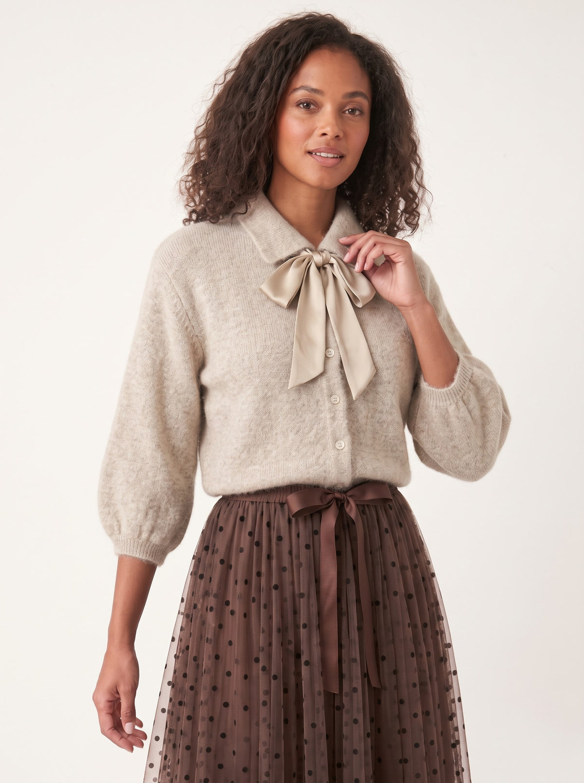 Antoinette oatmeal bow-tie cardigan styled with a brown tulle skirt