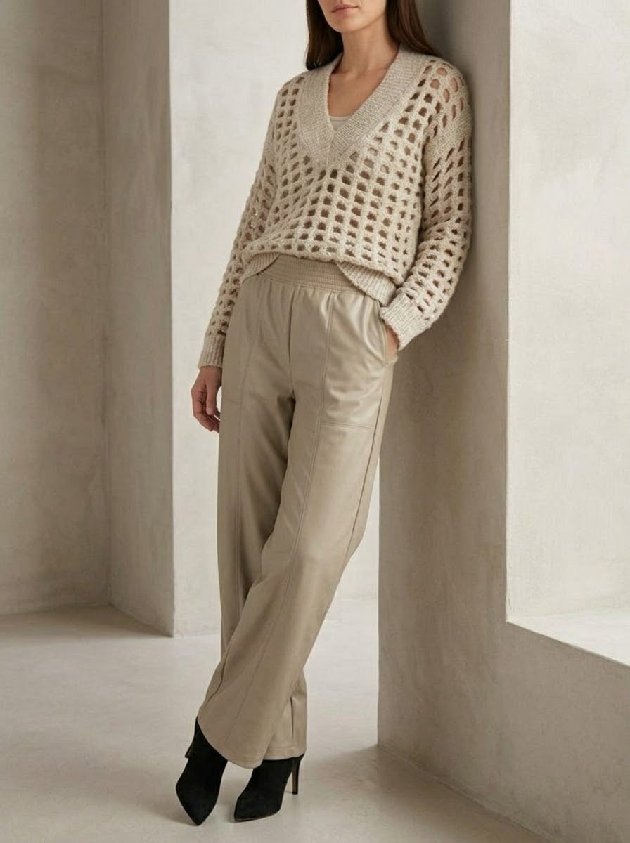 Meera stone V-neck jumper styled with matching-tone pleather trousers