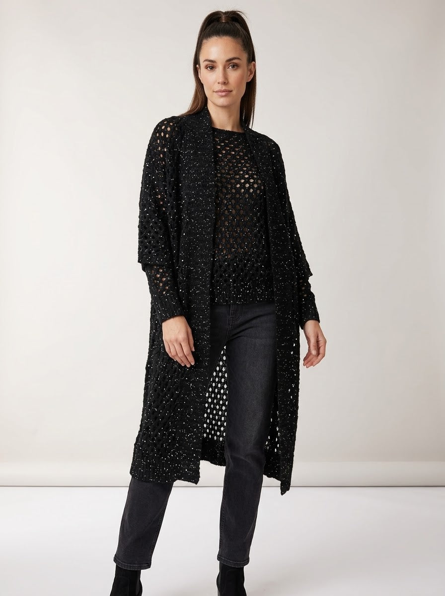 Model wearing the Barbados black long crochet cardigan, front view