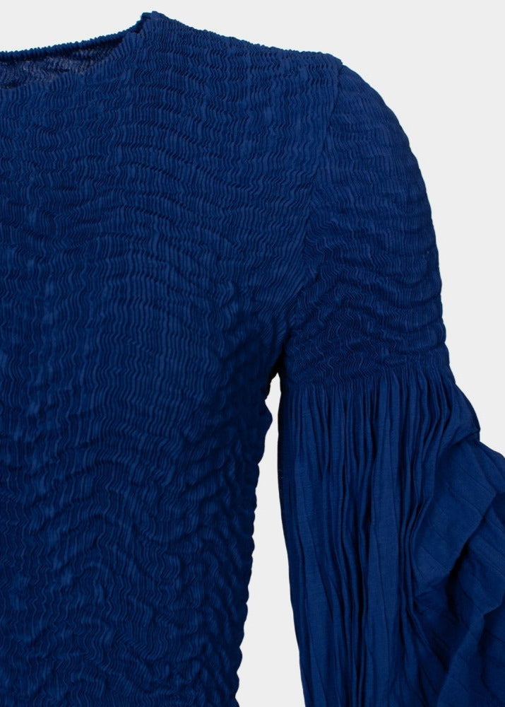 Miranda - Peplum hem part pleated top
