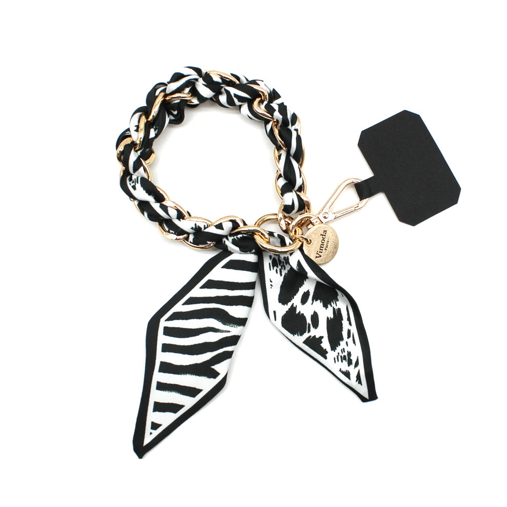 Black Sandi phone wrist strap with scarf-wrapped gold-tone chain, clasp and phone-case insert tab