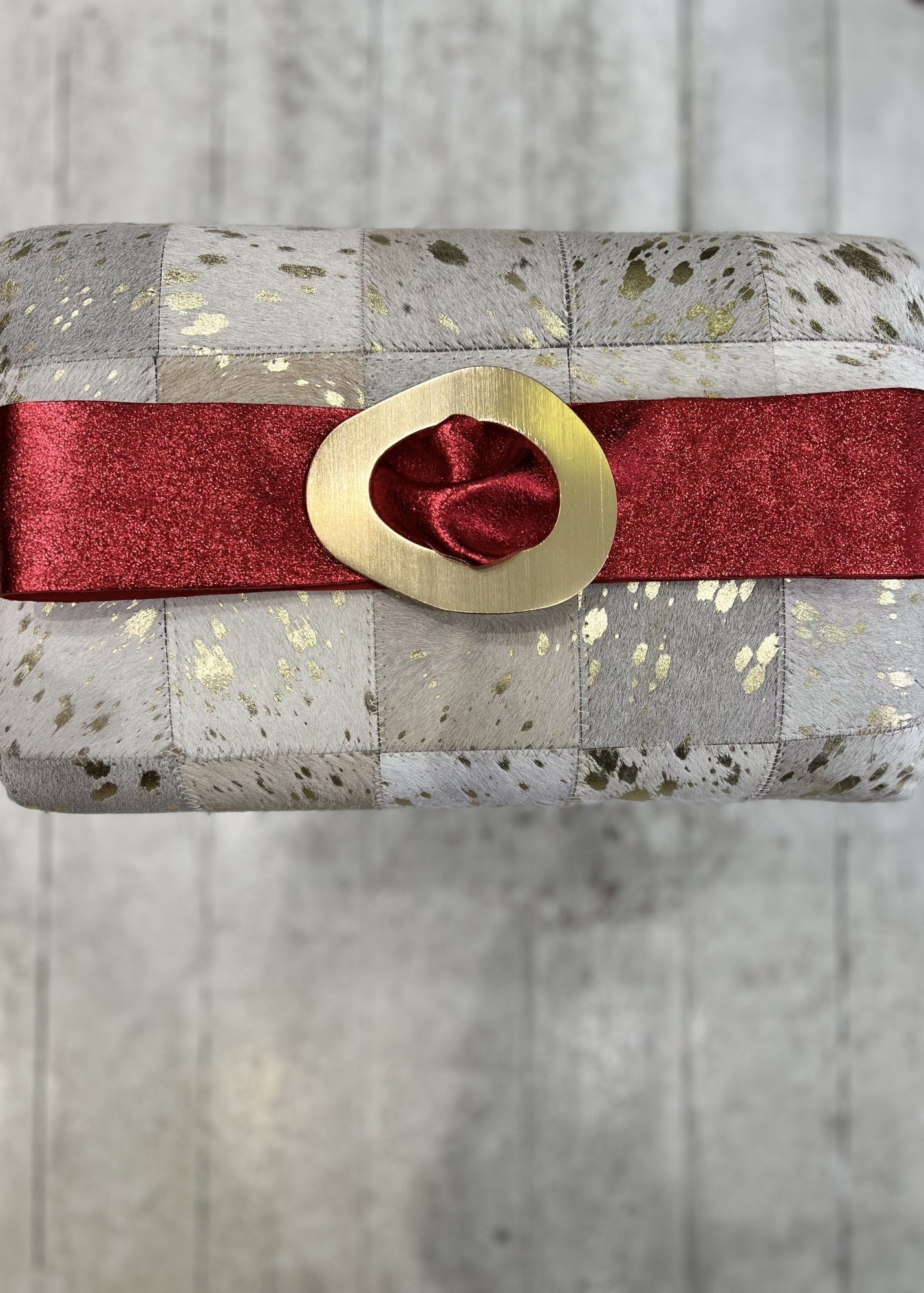 Metallic red leather gold tone buckle belt