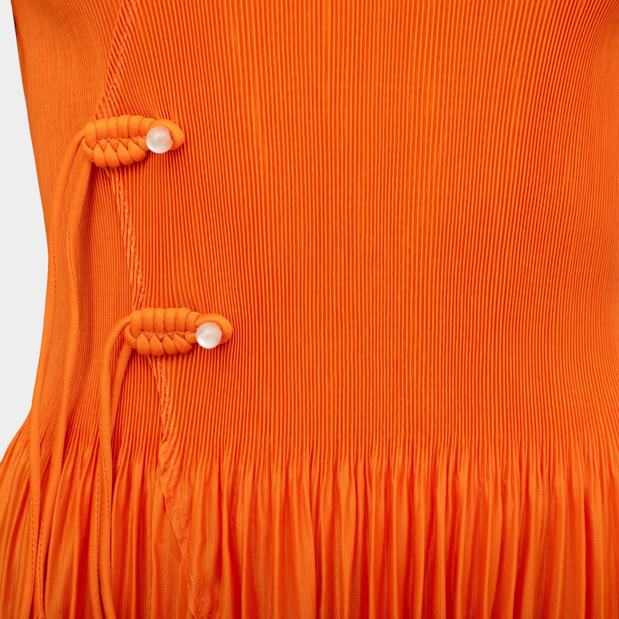 Anais orange cross front frill hem pleat top