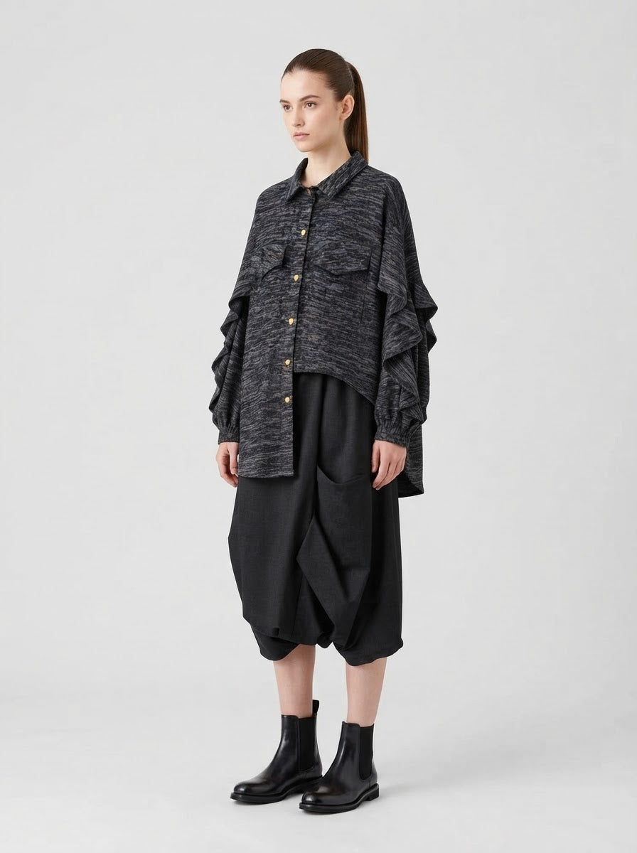 Model wearing the grey Capelini marl jersey blouse with layered frill sleeves