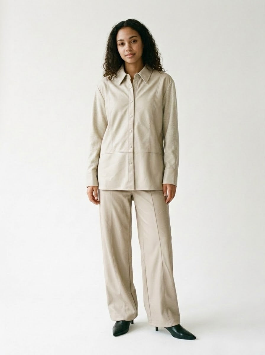 Back view of the Marley stone shirt showing its knitted panel and sleeves