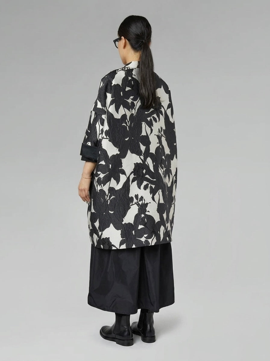 Back view of the Delani black-and-cream floral cocoon coat