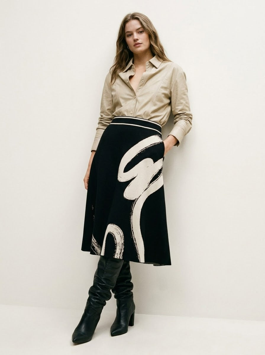 Hilda black printed knit skirt showing the elasticated waistband and pockets