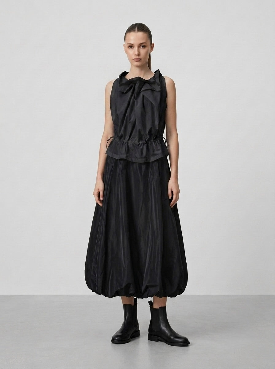 Model wearing black Marguitte skirt with black sleeveless top