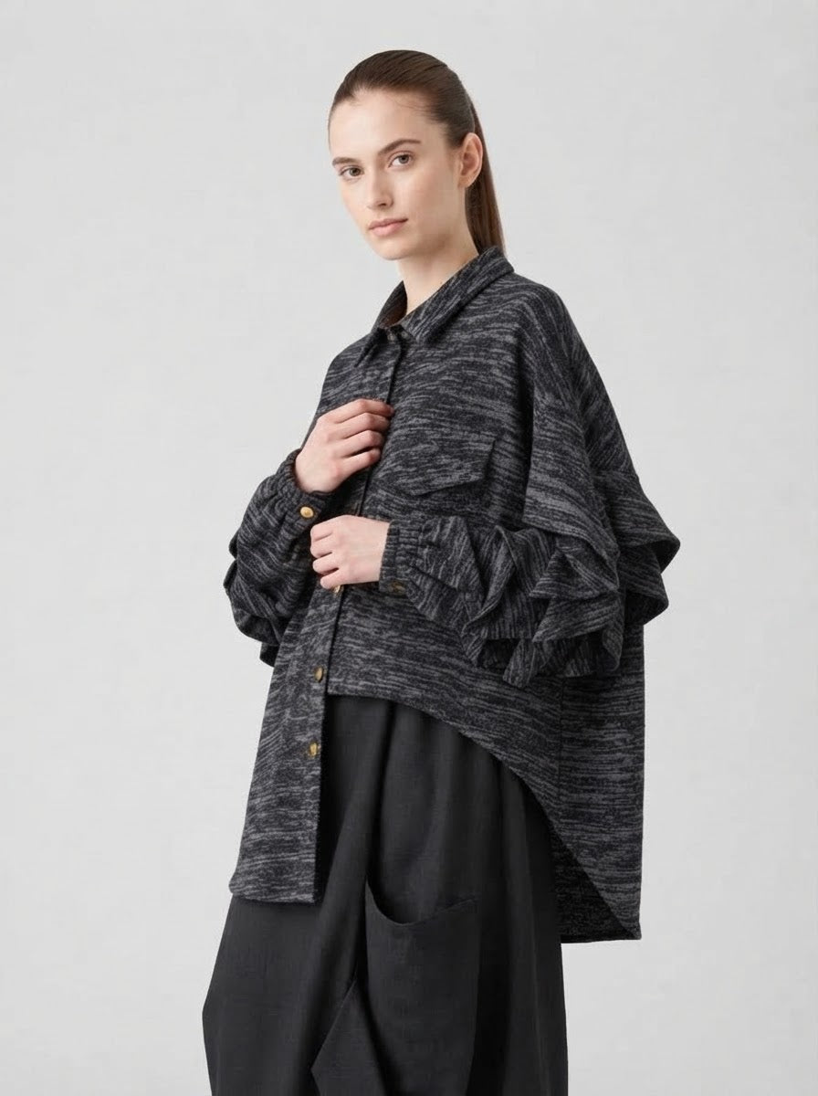 Side view of the loose-fitting grey Capelini marl jersey blouse