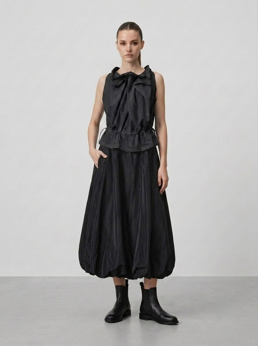 Model wearing black Marguitte balloon hem skirt, full front view