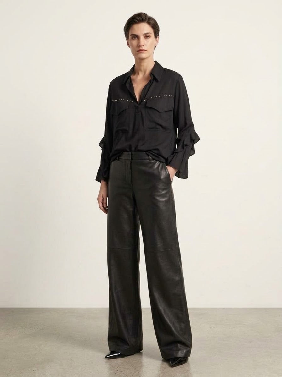 Fredi black wide leg pleather jeans styled with a black blouse