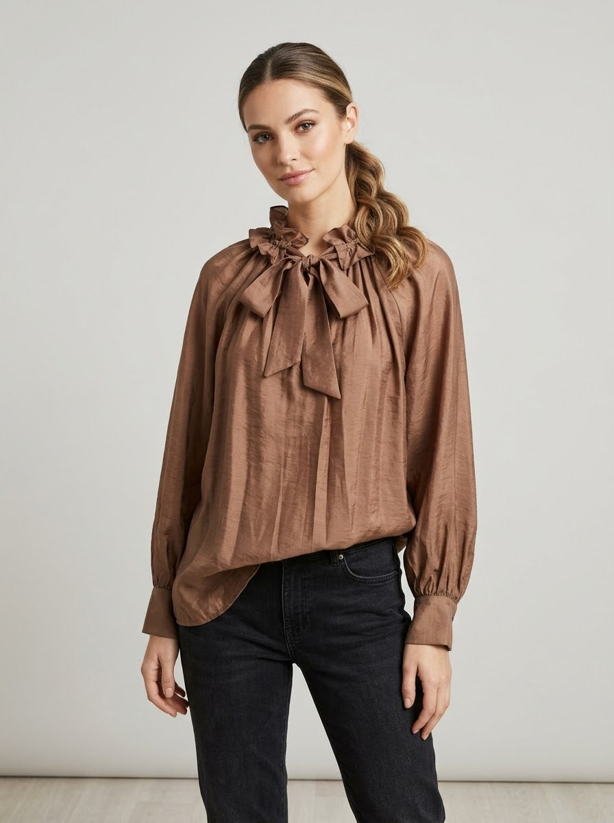 Ariel bronze self-tie blouse worn with black jeans