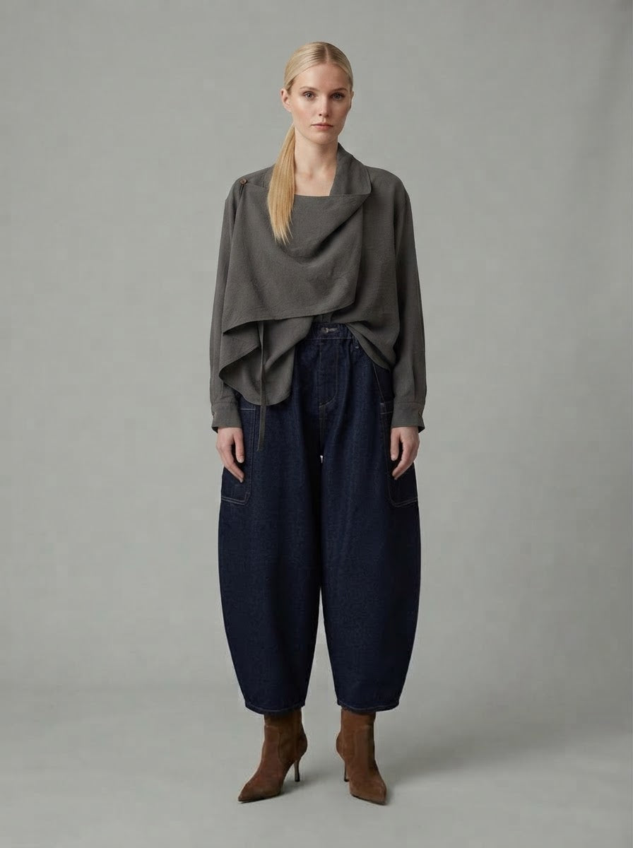 Model wearing chocolate Darla scarf collar blouse with balloon-leg jeans