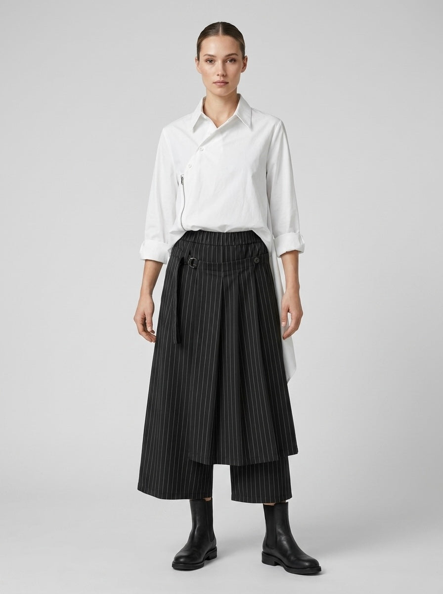 Model wearing the Sapphire black pinstripe trousers with detachable wrap panel