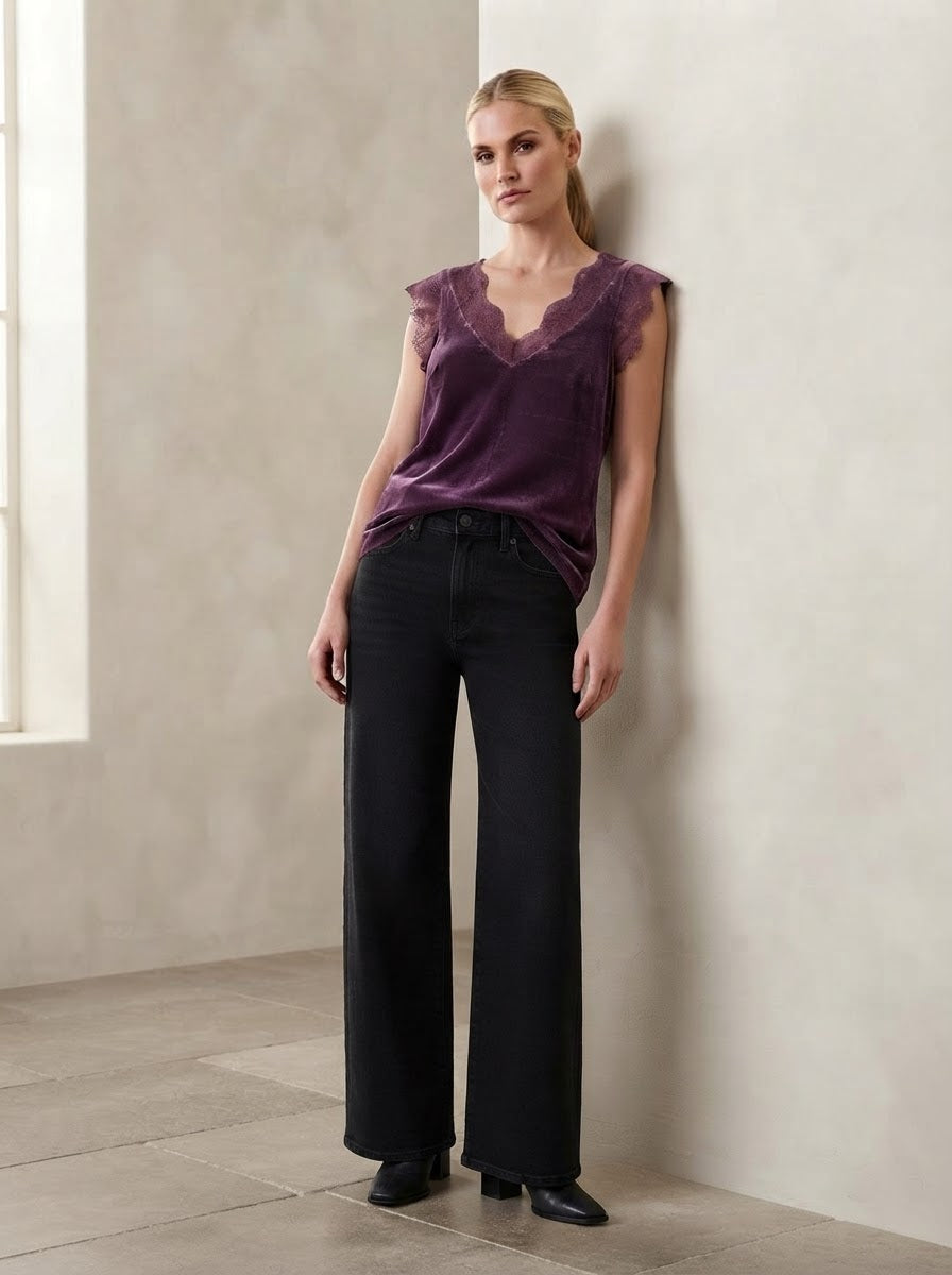 Model wearing the Plum Lacey satin viscose cami top with lace-trimmed V-neckline and arm openings