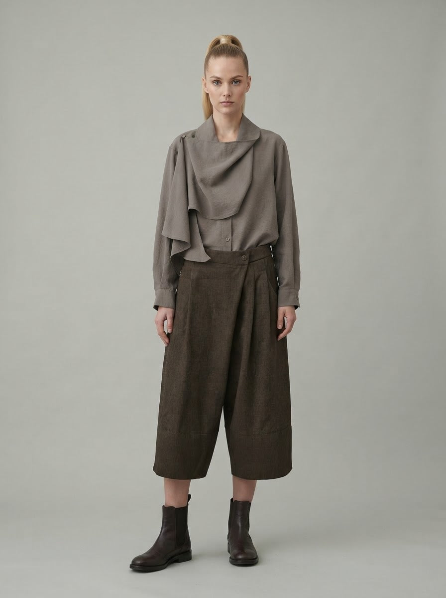 Model wearing taupe Darla scarf collar blouse with cropped trousers