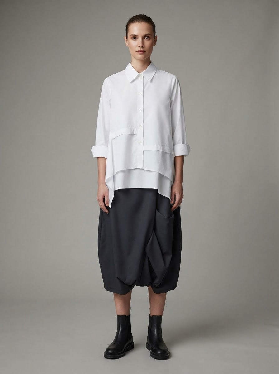 Model wearing white Gaynor cotton shirt with black harem trousers