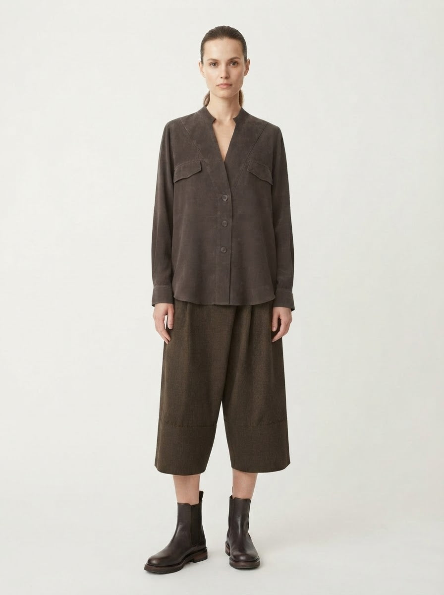Model wearing Rosie pocket flap blouse in chocolate, front view