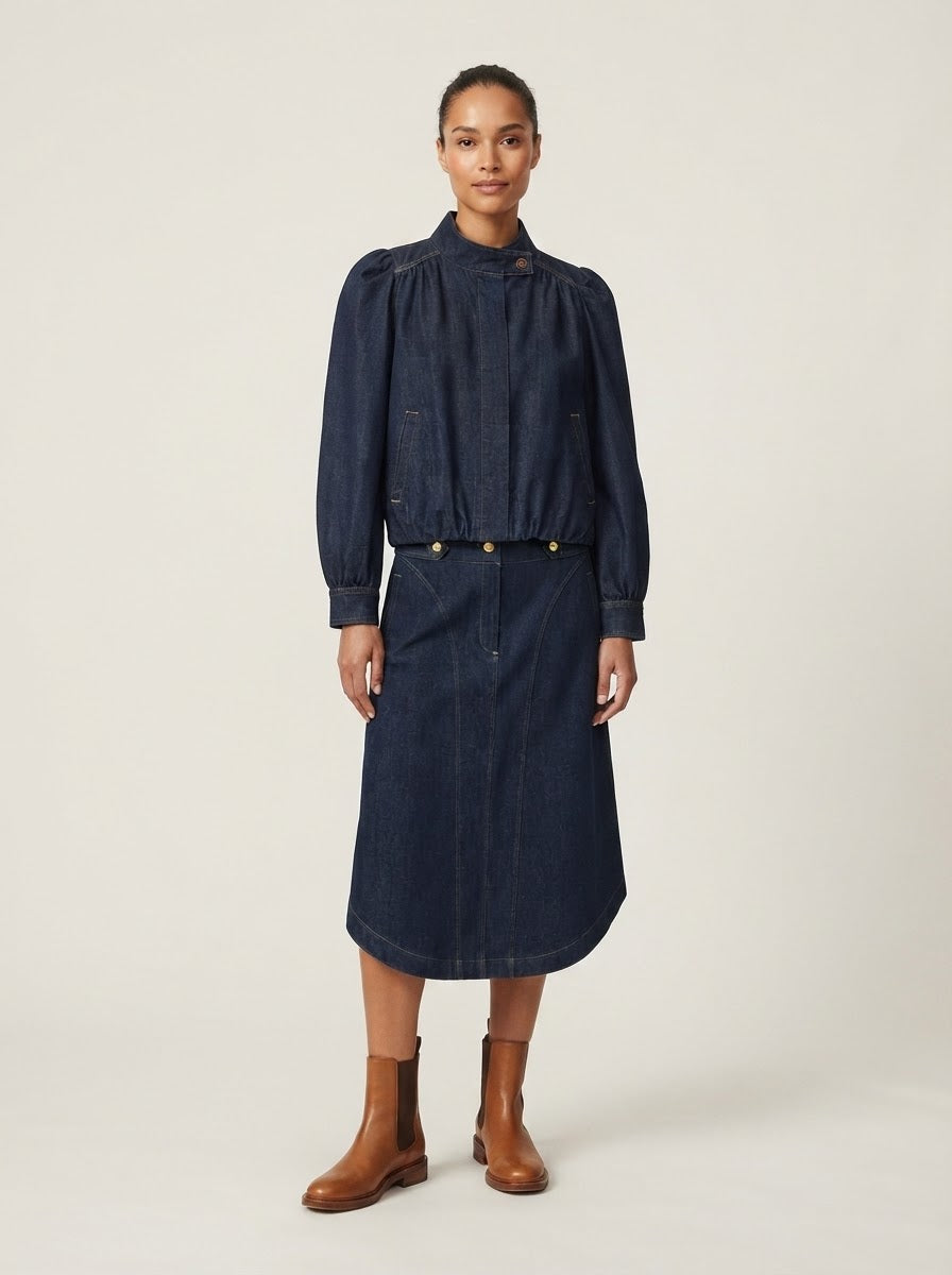 Model wearing Harper denim balloon jacket with matching skirt, front view