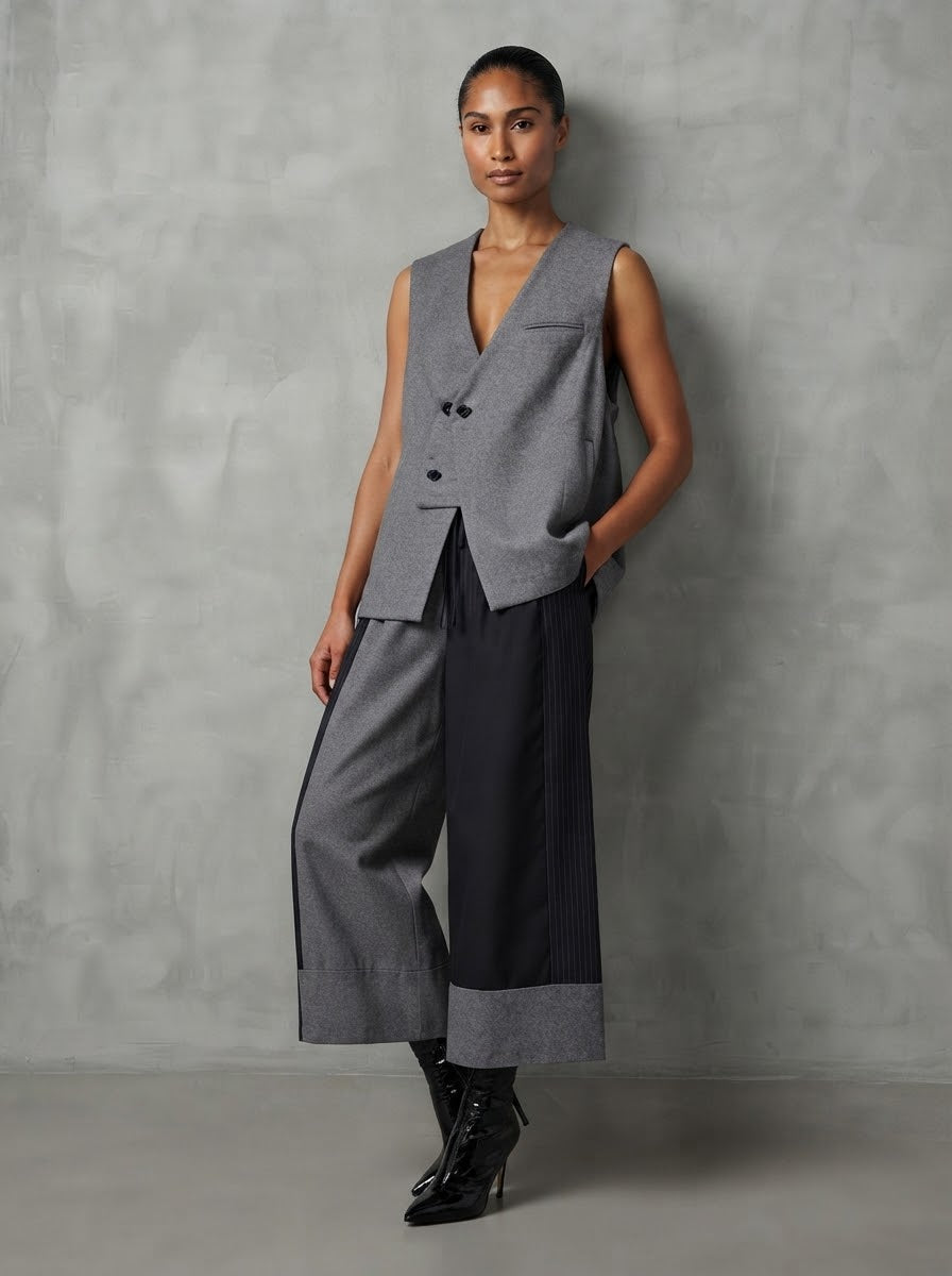Model wearing grey Valaria double-breasted gilet with wide-leg trousers, front view