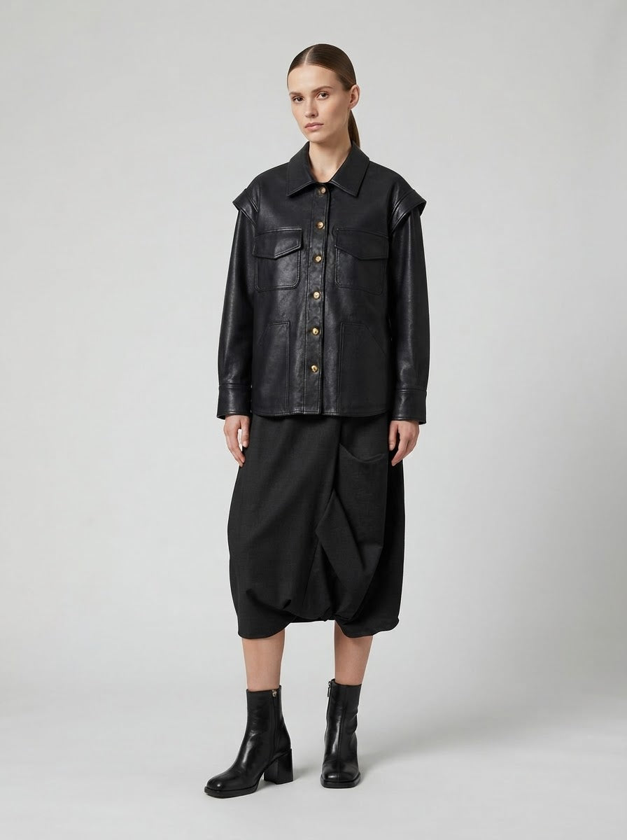 Model wearing the Chill black pleather shirt jacket, front view