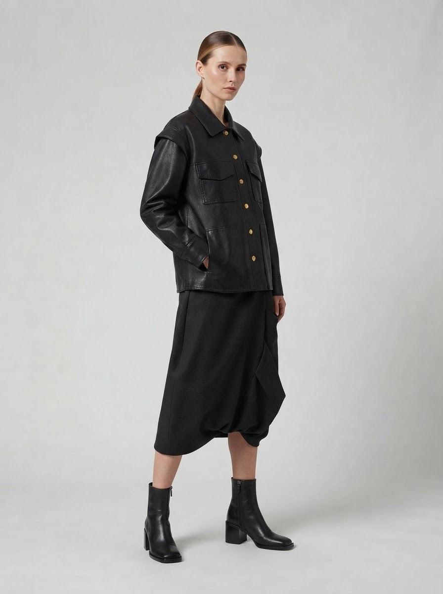 Model wearing the Chill black pleather shirt jacket, side view