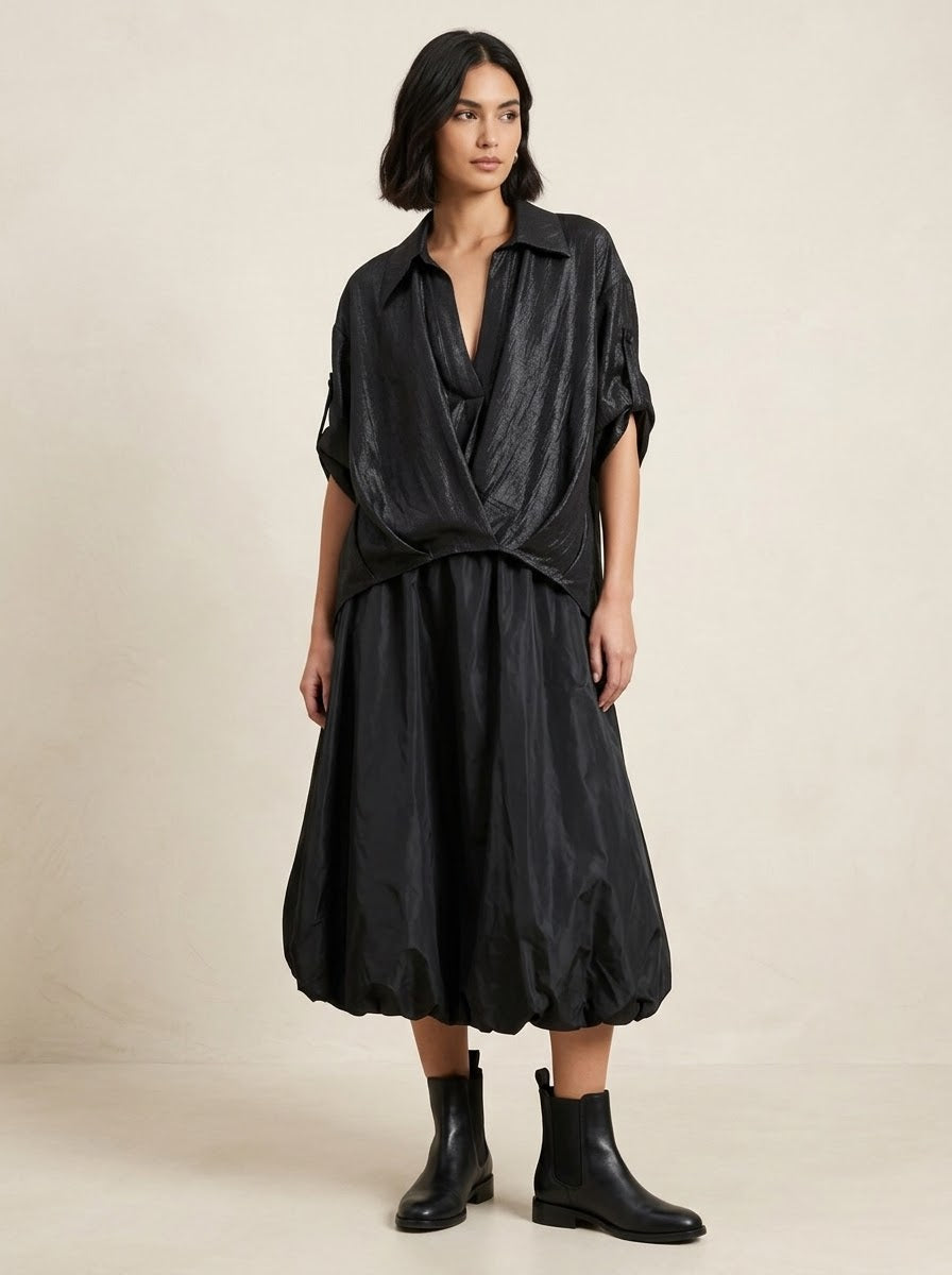 Model wearing black Lavender shimmer shirt with black balloon skirt, front view