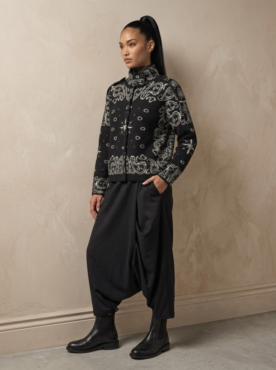 Model wearing Sadie paisley knitted jacket in black with black trousers