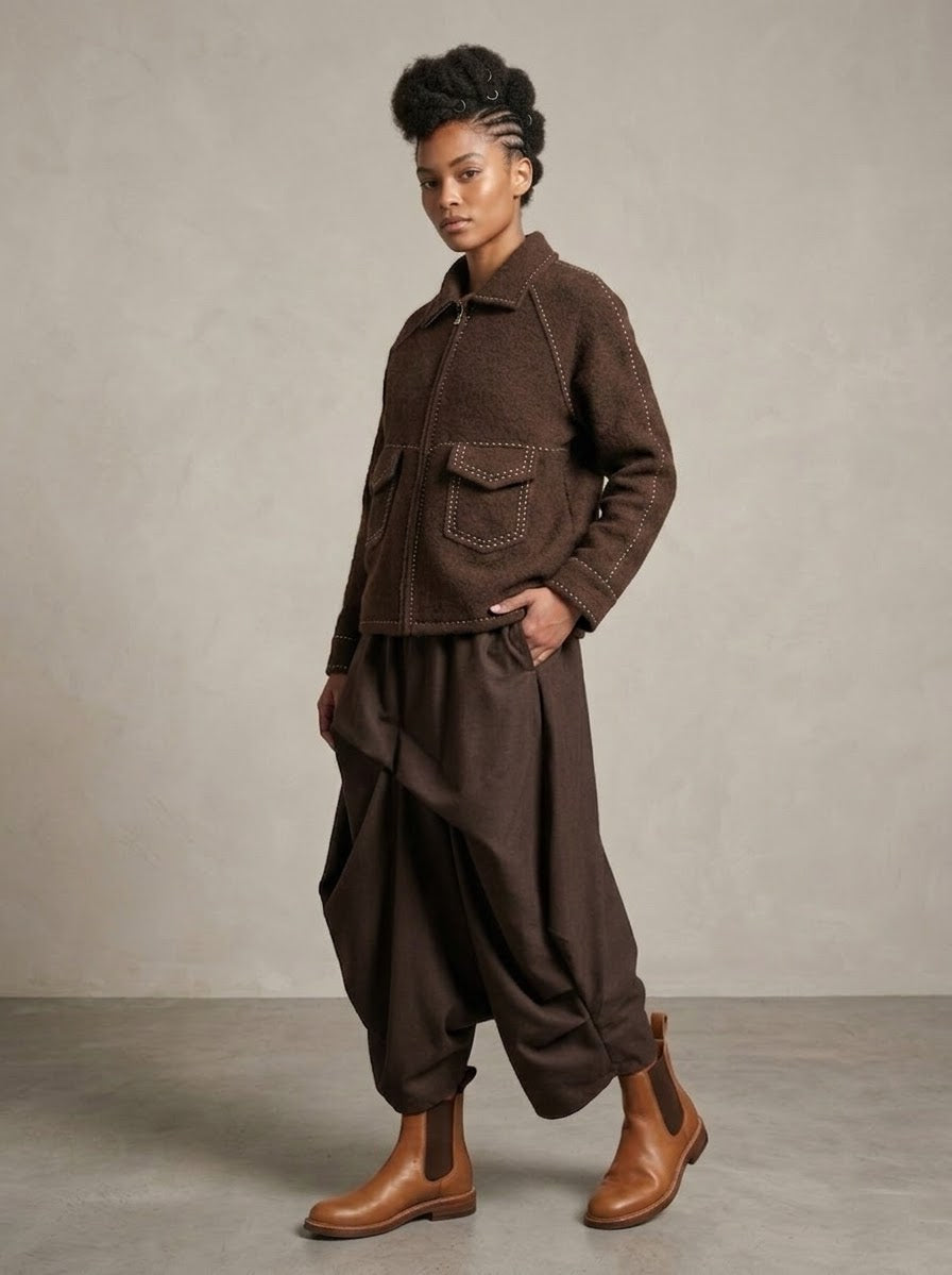Model wearing Sara saddle stitch knitted jacket in chocolate, full-length front view