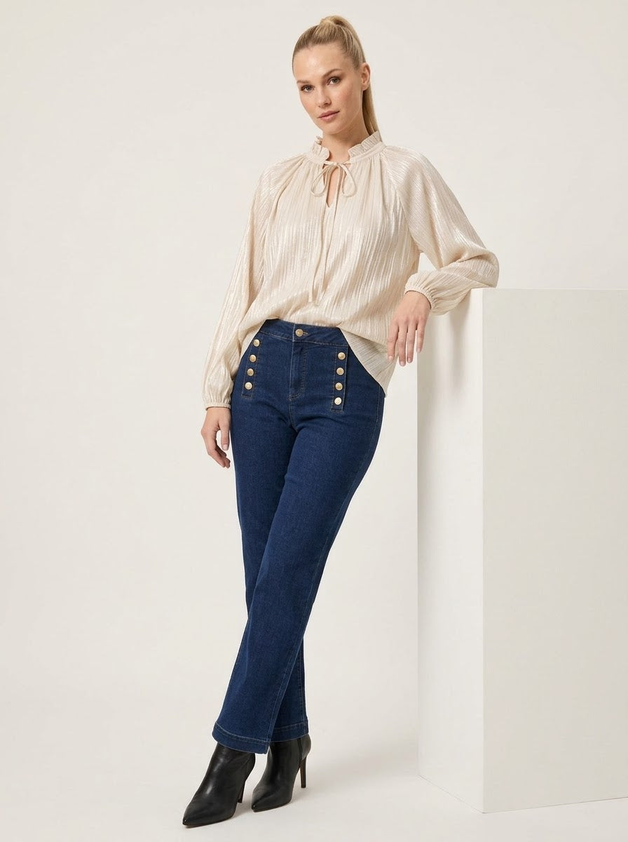 Model wearing cream Lilian lurex blouse, angled front view