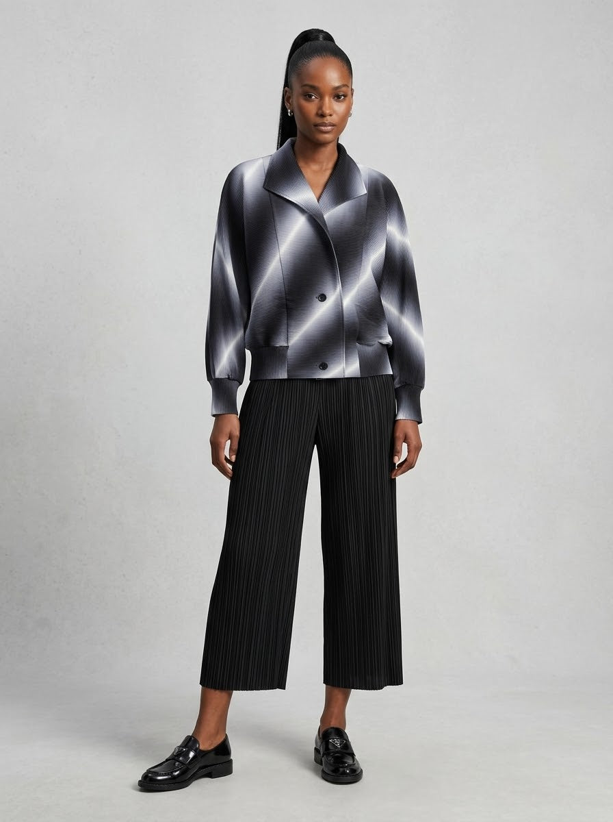 Model wearing Juliette pleated bomber jacket in grey, front view