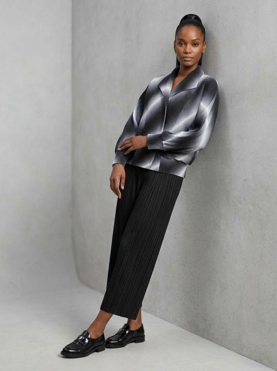 Model wearing grey Juliette pleated bomber jacket, three-quarter view