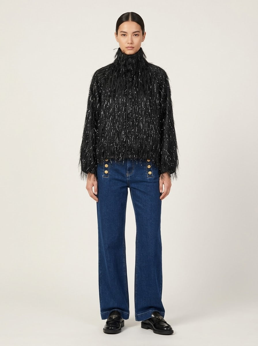 Model wearing Scarlett fringed chiffon jacket in black, front view