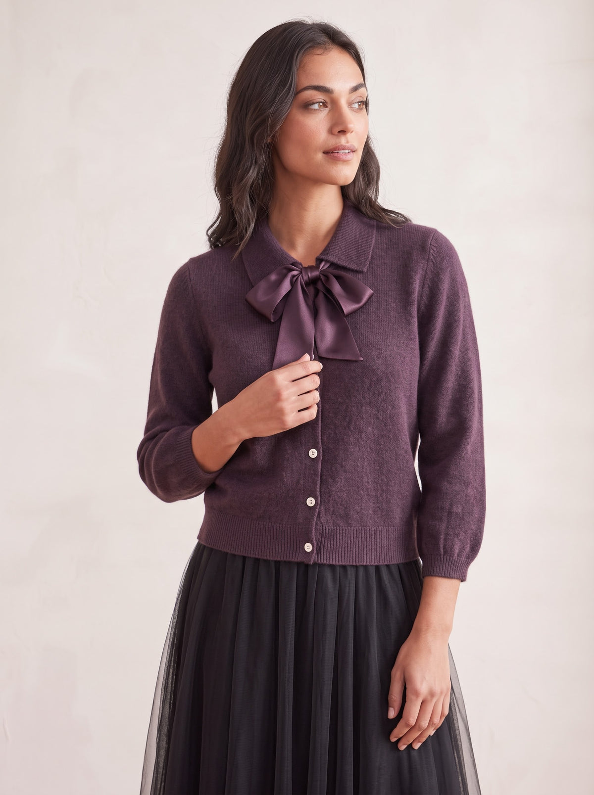 Close-up of the Antoinette plum cardigan with detachable satin bow