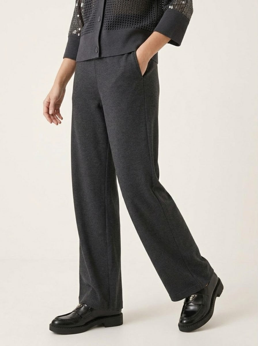 Model wearing the Abigail charcoal knitted wide-leg trousers