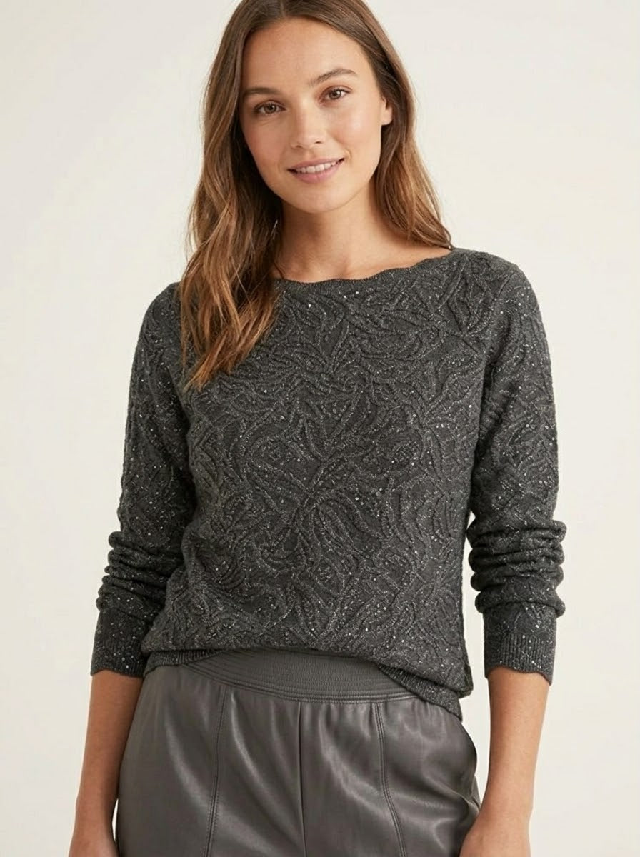 Model wearing the Imani grey embossed lurex jumper with pleather trousers